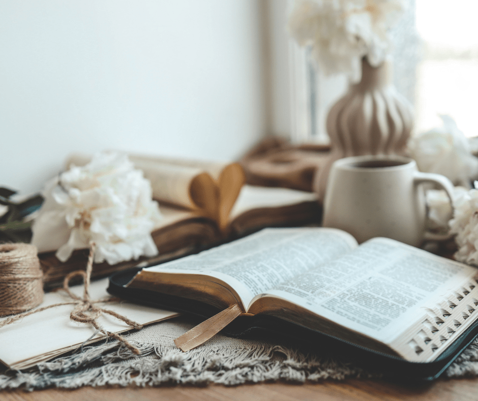 A bible is surrounded by cozy things